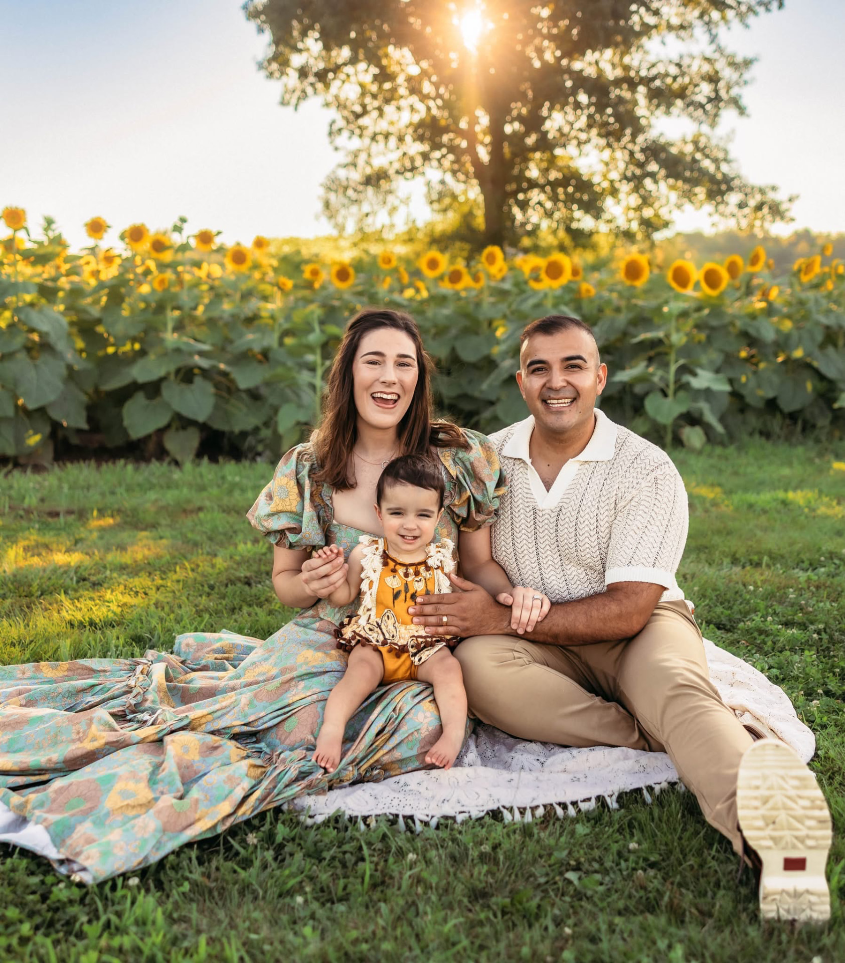 Raul Quinones with his family in a sunflower field